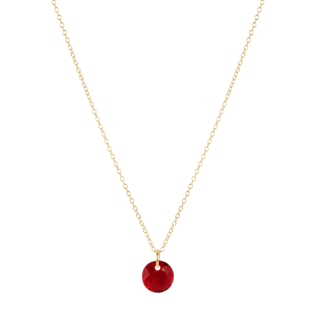 Gold necklace with a red pendant on a white background